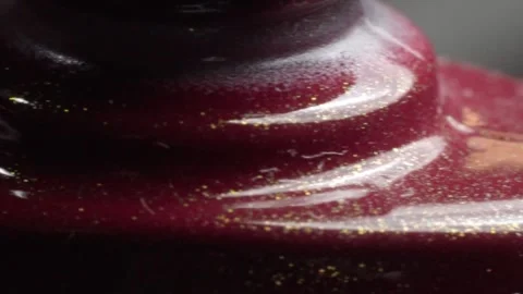 Close Up of Red Glitter Makeup Surface With Glossy Cosmetic Texture Stock Footage 346502248