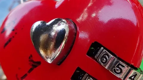 Close-up of red heart shaped padlock on a bridge 4k footage Video stock 110725187