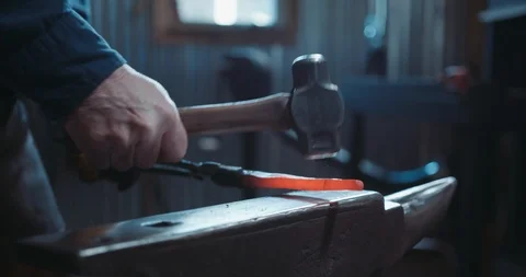 Close up of a red hot iron being hammered Stock Footage 105295178