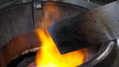 Close-up of Red-Hot Metal in a Blacksmith's Forge with Intense Orange Flames Vídeos de archivo 332817402