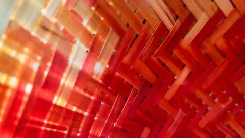 Close-up of red illuminated woven structure with dynamic lines and soft glo.. Stock Photos
