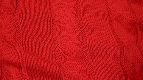 Close-up of red knitted fabric texture. Knitted texture of soft wool and cotton  Stock Footage 122246915