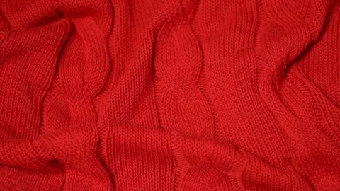 Close-up of red knitted fabric texture, soft cotton plaid, textiles, bedspreads. Stock Footage 122246938
