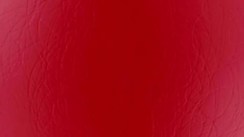 Close-up of Red Leather Texture with Fine Grain and Natural Pattern Stock Footage 338195768