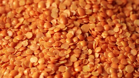 Close up red Lentil seed texture background food footage rotate Stock Footage 254390207