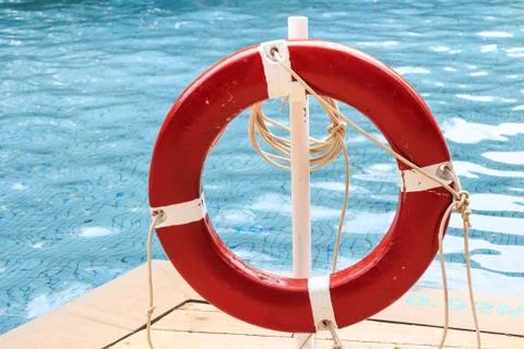 Close up of red life ring at the pool Stock Photos