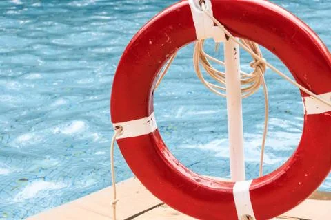 Close up of red life ring at the pool Stock Photos