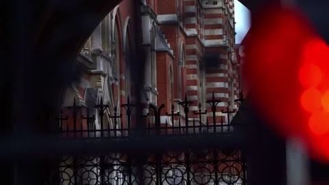 Close-Up of Red Light and Closed Gates at Royal Courts of Justice, London Stock Footage 286134924