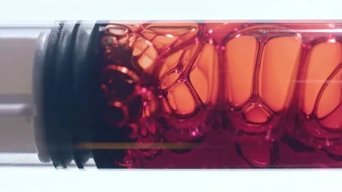 Close up of red liquid drawn into syringe macro shot of bubbly blood Vídeo Stock 146478709