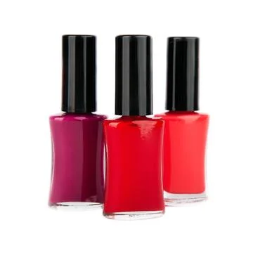 Close up of red nail polish flow isolated on white background Stock Photos