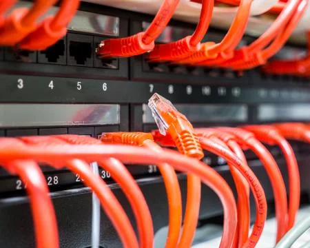 Close up of red network cables connected to switch Stock Photos