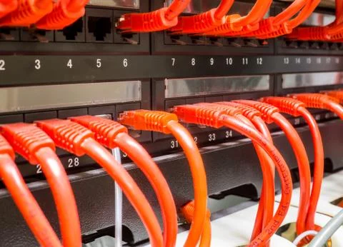 Close up of red network cables connected to switch Stock Photos