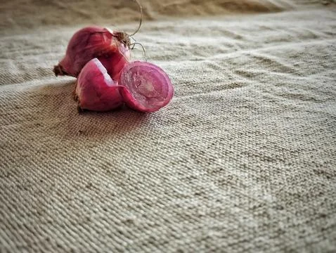 Close up of red onion on brown background Stock Photos