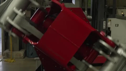 Close up of a red painted grapple body with silver steel arms swinging as the 库存影片 341575808