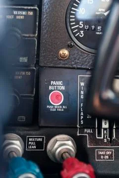 Close-up of red panic button in cockpit, Venezuela Stock Photos