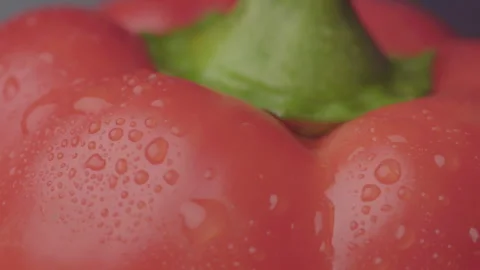 Close-Up of Red Pepper with Water Drops Moving from Left to Right Video stock 330941816