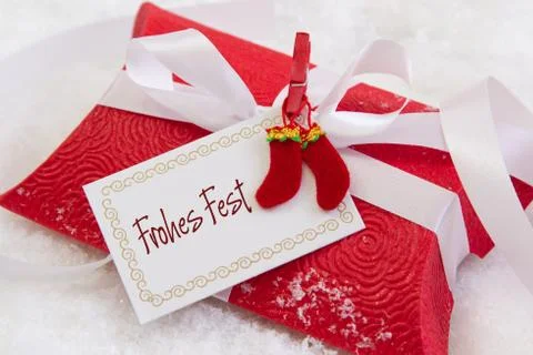 Close up of red present box with german text for christmas Stock Photos