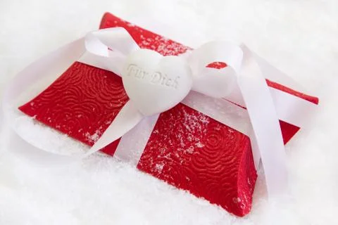 Close up of red present box with german text for christmas on white backgroun Stock Photos