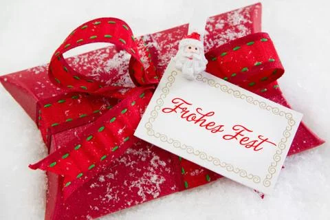 Close up of red present box with german text for christmas - coupon for a gif Stock Photos