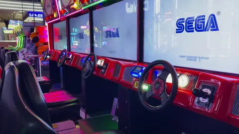 Close up of red racing simulator arcade steering wheel and dashboard wit dave-12 Stock Footage 339492498