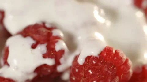 Close-up of red raspberries with cream Stock Footage 39985154