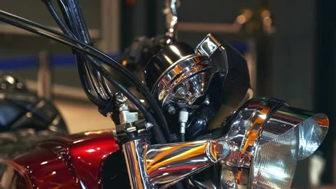 Close-up of red retro motorcycle front details in indoor exhibition Stock Footage 340880787