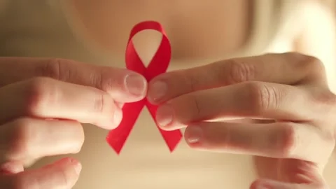 Close-Up of Red Ribbon for World AIDS Day Awareness Stock-Footage 317042153