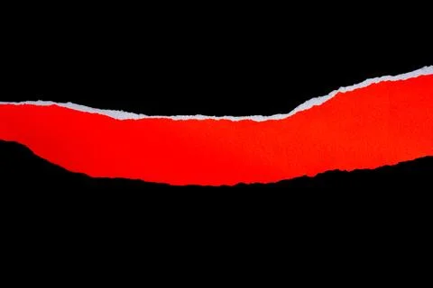 Close up of a red ripped or torn piece of paper with copy space, isolated b.. Stock Photos