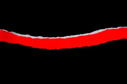 Close up of a red ripped or torn piece of paper with copy space, isolated b.. Stock Photos
