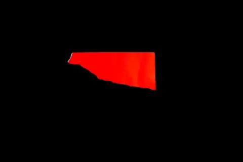 Close up of a red ripped or torn piece of paper with copy space, isolated b.. Stock Photos