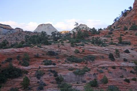 Close up of red rocks wall with the white Checkerboard Mesa on the back in Zi Stock Photos