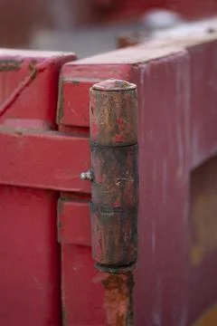 Close up of red rusty metal hinge. Stock Photos