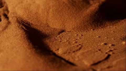 Close up of red sand from the desert in Morocco, moving under vibration and wind Stock Footage 107188059