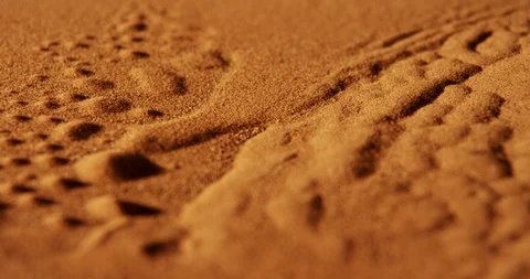 Close up of red sand from a desert, moving under vibration like in a Sandstorm Stock Footage 107212895