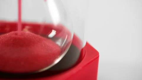 Close up of red sand timer showing voting, panic or danger  Stock Footage 252521414
