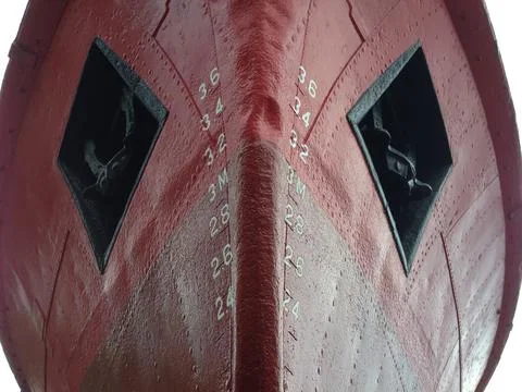Close up of red ship bow with numbers and openings Stock Photos