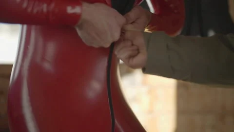 Close-up of red ski suit being zipped up 库存影片 346055898