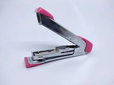 Close-Up Of Red Stapler Against White Background Stock Photos
