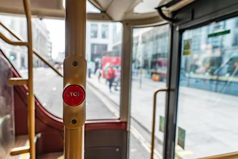 Close Up of the Red Stop Button on a London Bus with the City Street Visibl.. Stock Photos