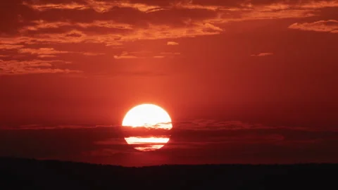 Close Up Red Sunrise with Clouds Time Lapse Stock Footage 138315124