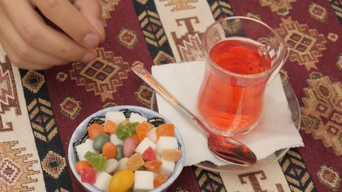 Close-up of a Red Tea and Sweets Sugar on Table in Oriental Restaurant Stock-Footage 93006170