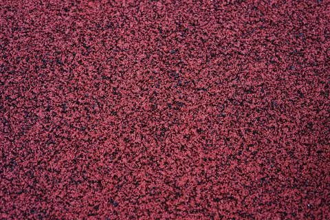 Close-up of a red textured abstract background with various fragments scatter Foto stock