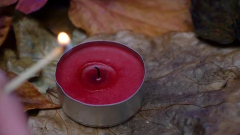 Close-up on a red wax candle. Stock Footage 99446947