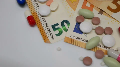 Close up, with red, white, colored pills rotating, from the the top side Stock Footage 86177167