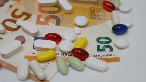 Close up, with red, white, colored pills rotating, from the the top side Stock Footage 86178056