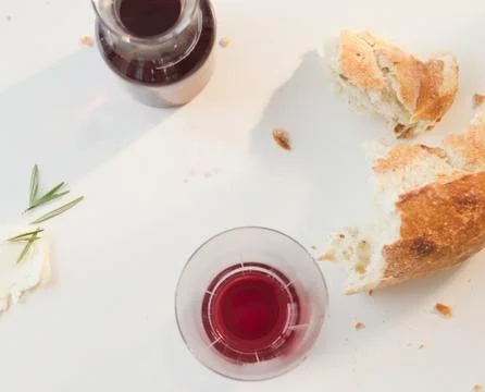 Close up of red wine and bread on table Stock Photos
