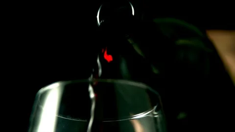 Close up of red wine being poured into glass. Slow motion 4k Stock Footage 89650882