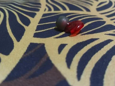 Close-up of the Red Wireless Earbuds Photos