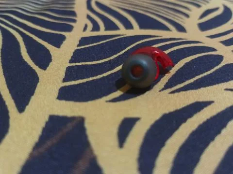 Close-up of the Red Wireless Earbuds Stock Photos