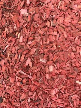 Close-up of Red wood Chips backdrop. Natural Mulch background for garden design Stock Photos